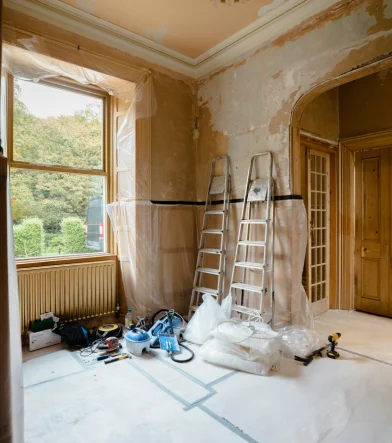 Interior renovation of a living room, featuring modern furnishings and a fresh color scheme.